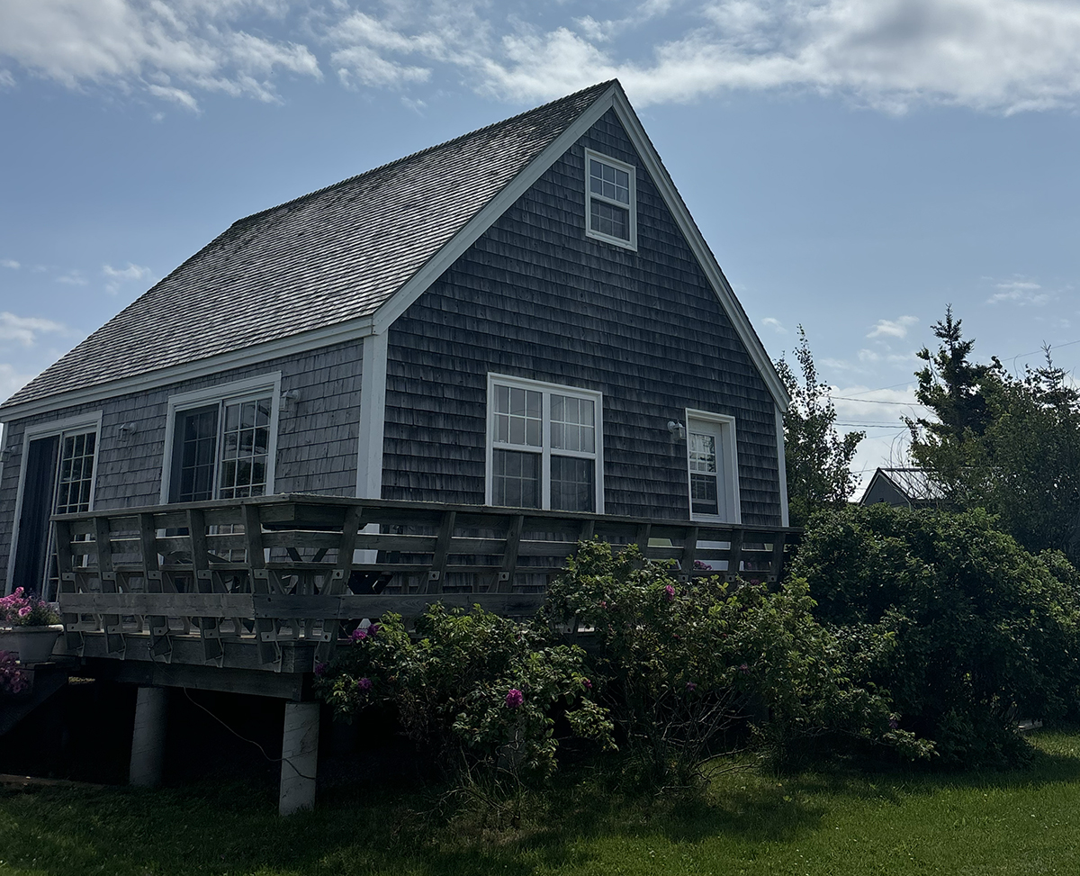 The house includes a wrap-around patio balcony.