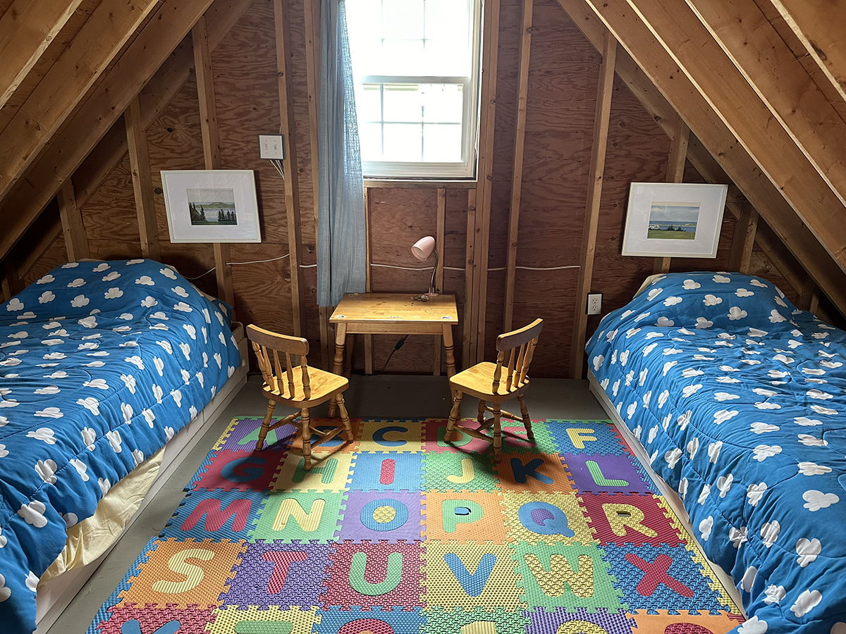 The upper level offers bedding for two children.